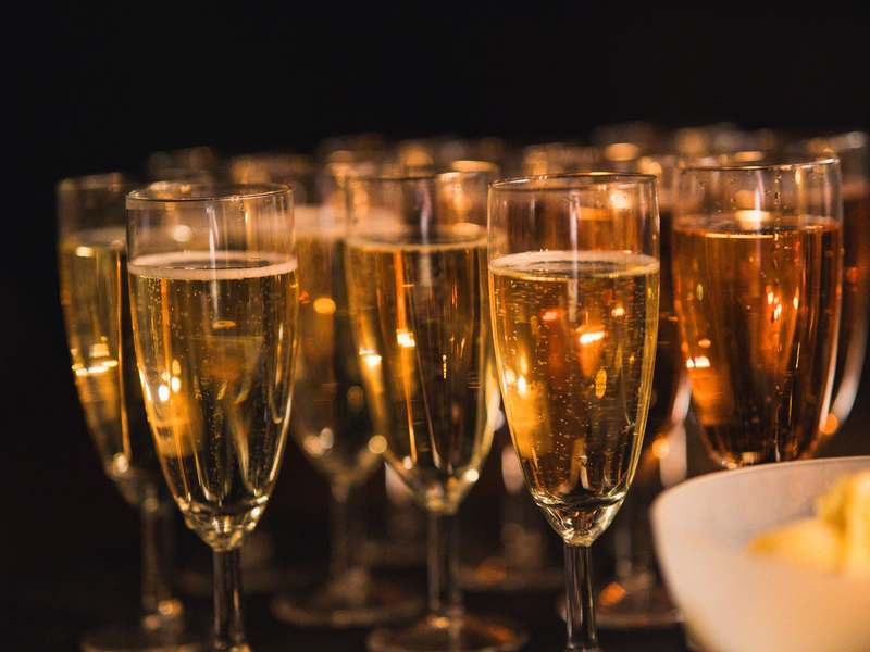 Guests raising champagne glasses in a toast